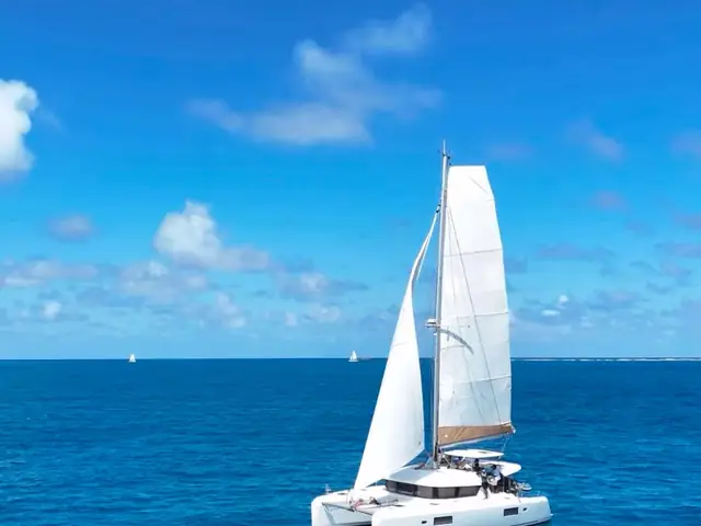 42-foot sail catamaran with sails up on clear blue water in Puerto Rico