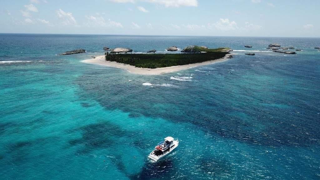 A private charter boat anchored in clear turquoise water off Fajardo, Puerto Rico