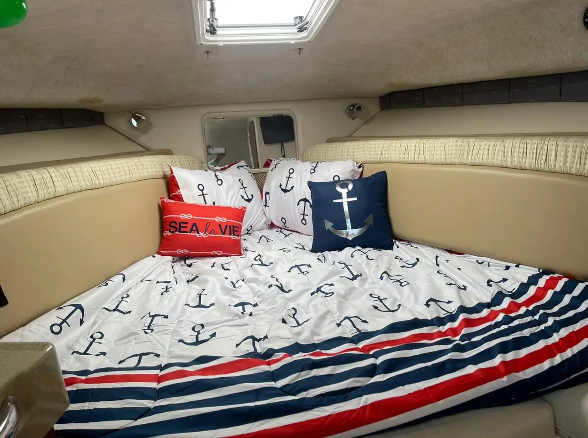 Interior cabin of the Wellcraft yacht with upholstered seating and sleeping berth - air conditioned private yacht rental Puerto Rico